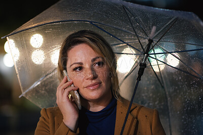 Buy stock photo Outdoor, umbrella and woman with phone call at night, digital communication and commute for networking. Smile, rain and calm person with mobile for online conversation, bokeh and late travel in city