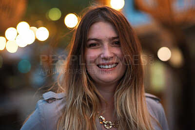 Buy stock photo Night, portrait and woman with smile for festival, holiday experience and abroad for weekend travel. Bokeh, evening event and female person with happiness for tourism, overseas vacation and wellness