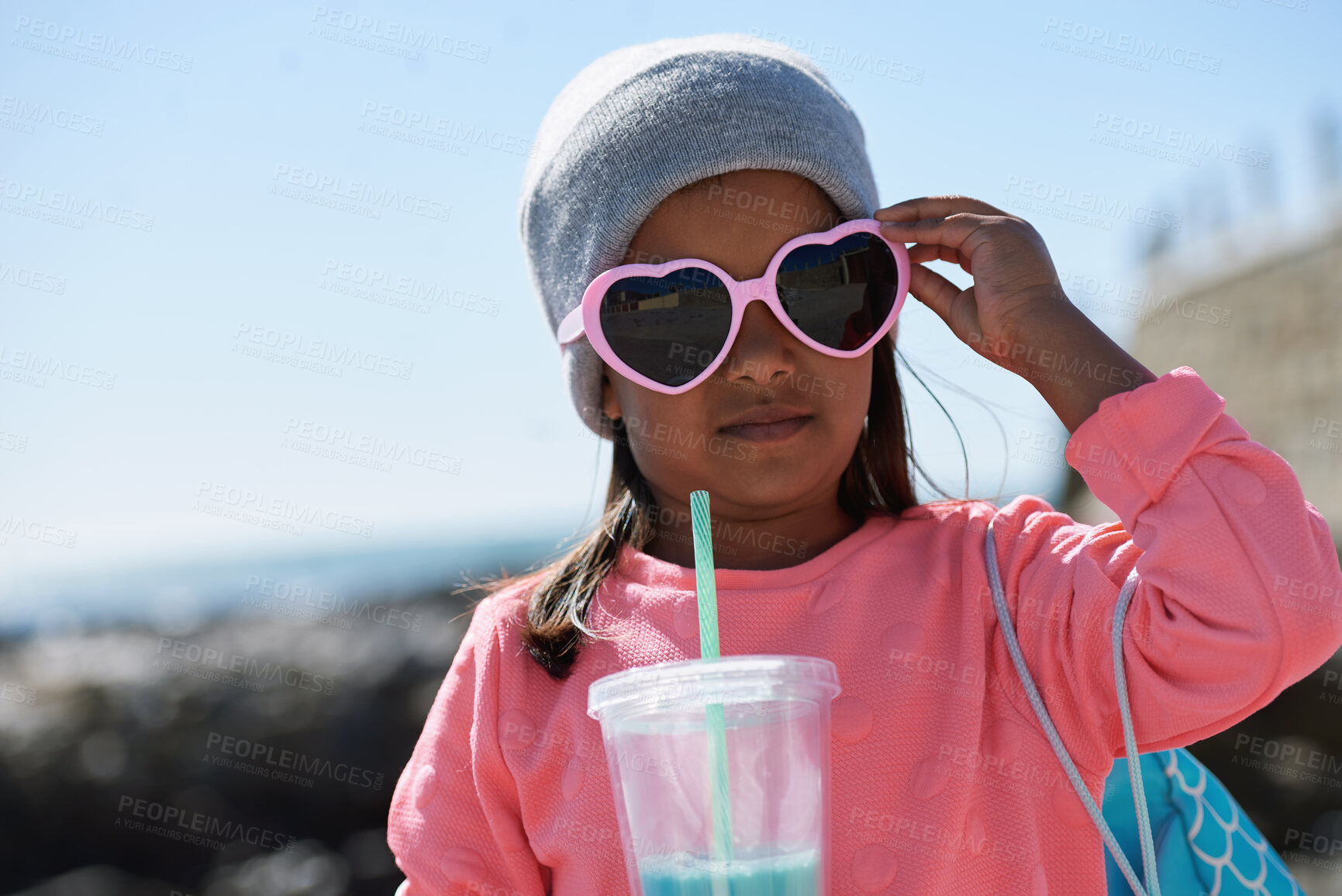 Buy stock photo Outdoor, sunglasses and girl with milkshake for holiday, winter outfit and travel destination for trip. Space, shades or child with tumbler cup for vacation, nature or stylish accessories for weekend