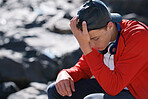 Unhappy teenage boy feeling depressed sitting by ocean teen suffering from anxiety