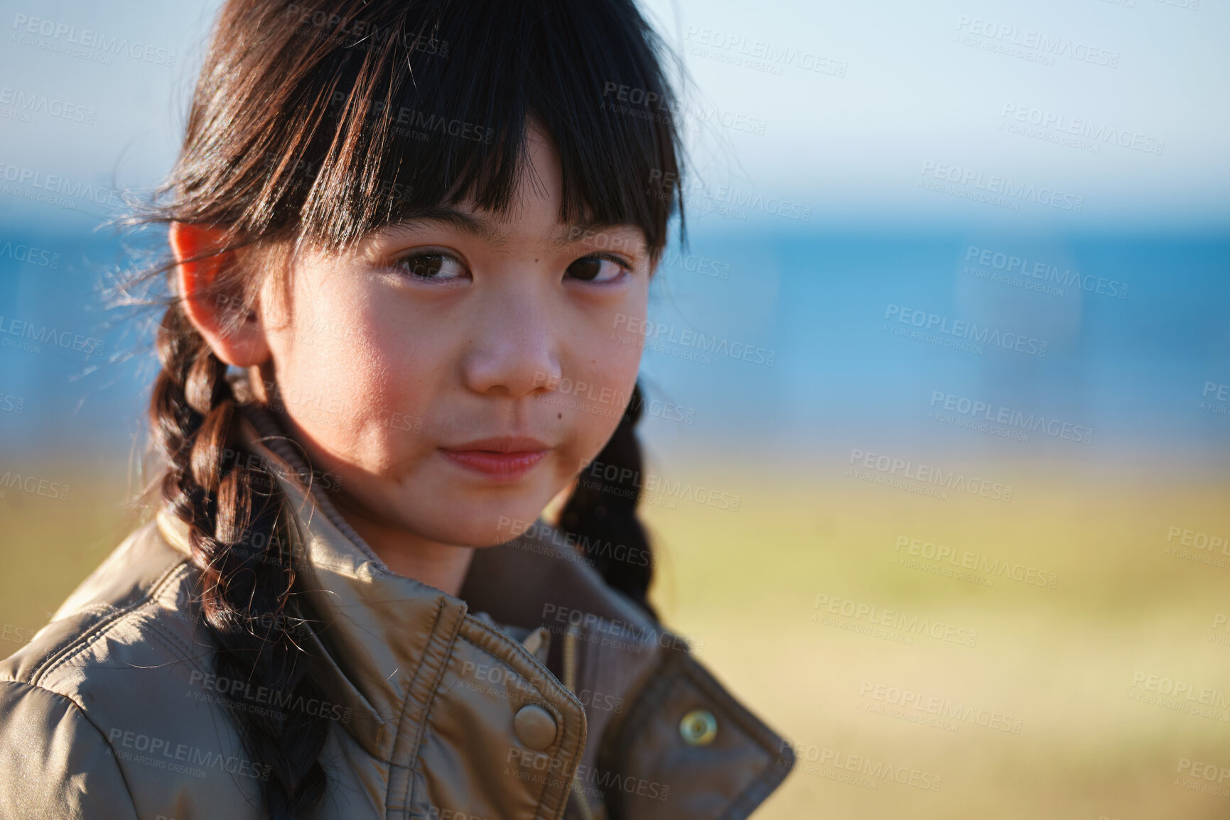 Buy stock photo Growth, calm and portrait of child in nature with confidence for holiday, break or vacation. Development, summer and Asian girl kid by grass outdoor in park for relax on weekend trip and space.