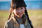 Portrait little asian smiling happy child in park 