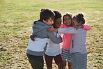 happy children hugging having fun playing in park