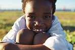 Portrait little african american boy smiling looking happy on summer day in park