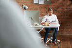 Businessman using digital tablet at his desk