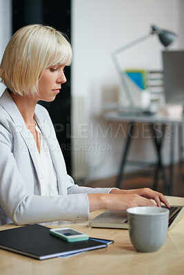 Buy stock photo Business, laptop and typing with designer woman in office for planning or research. Coffee, computer and report with design employee in creative workplace for administration or email feedback