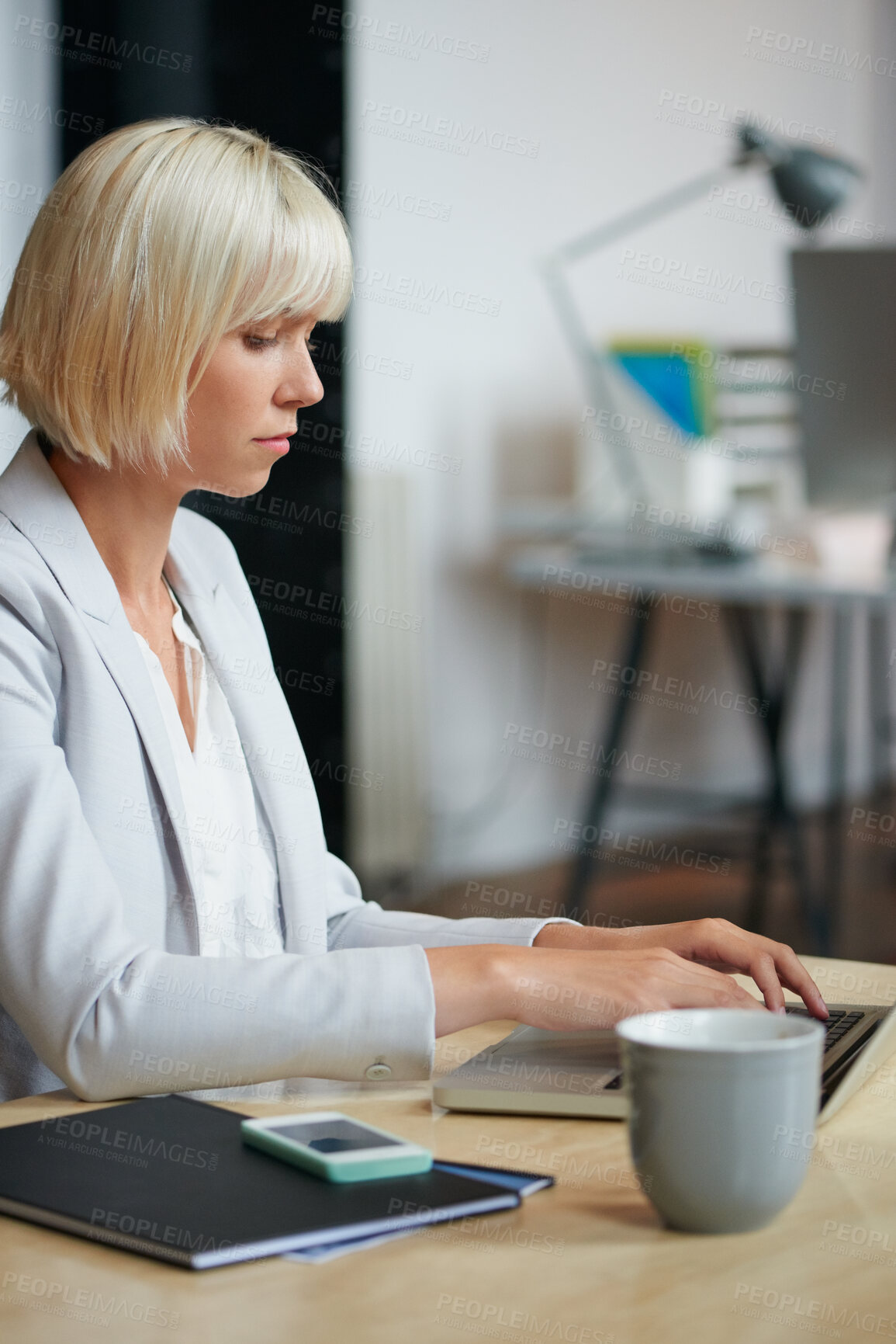 Buy stock photo Business, laptop and typing with designer woman in office for planning or research. Coffee, computer and report with design employee in creative workplace for administration or email feedback