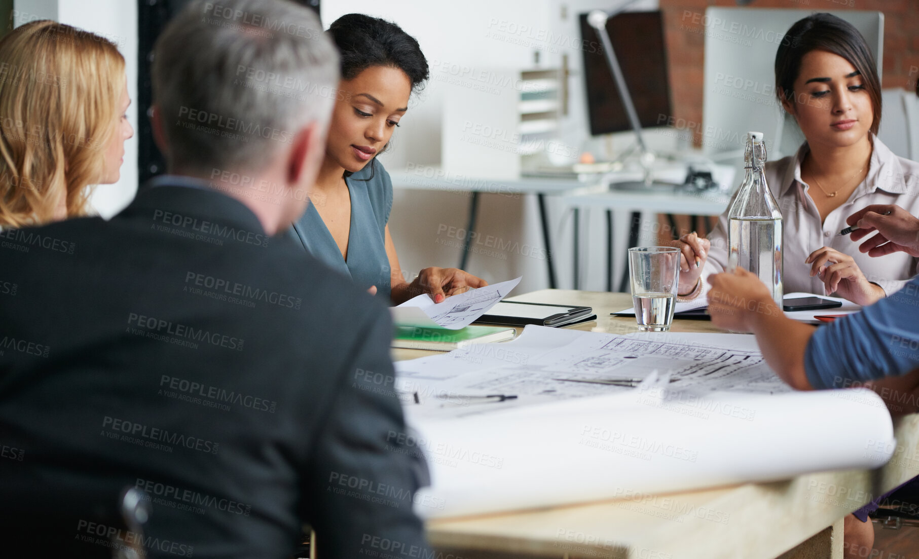 Buy stock photo Meeting, blueprint and discussion with architect in office for development update, review or planning. Team, people and brainstorming with documents for construction project, design or strategy