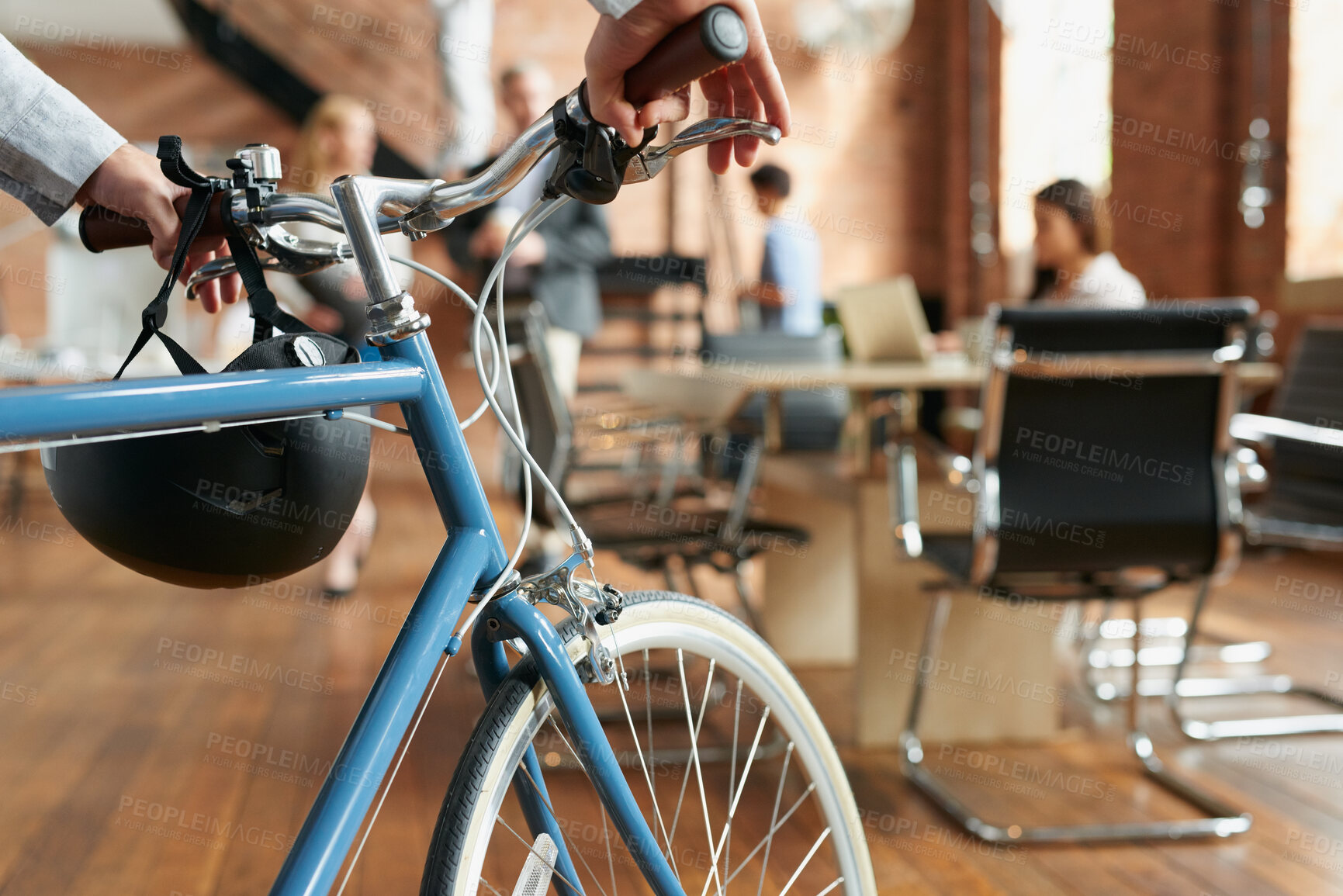 Buy stock photo Business, sustainable and hands in agency with bicycle, low carbon and green travel to workplace. Cycling, handlebar and person with bike, eco transport and emission reduction in employee commute.