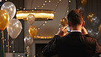 Back view of man in suit captures d&Atilde;&copy;cor using smartphone