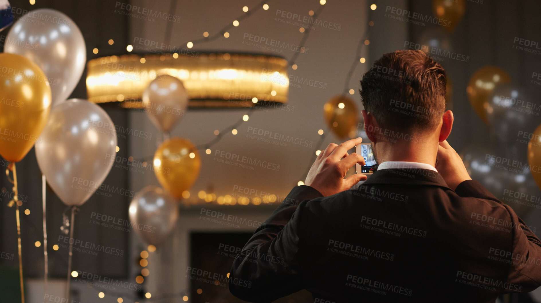 Buy stock photo Back, decor and photograph on phone with event organizer at venue for new year party. App, balloons and interior designer  man in hall with picture as function coordinator for celebration at night