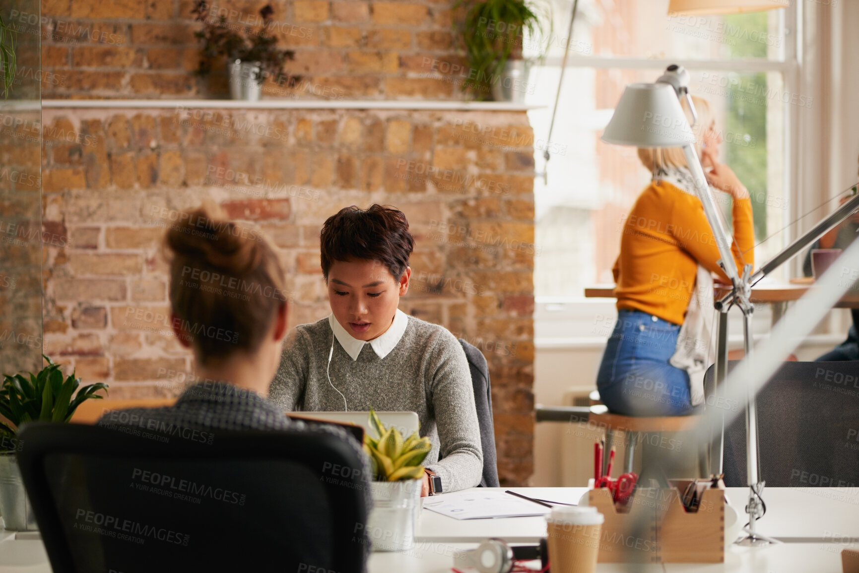 Buy stock photo Research, earphones and woman with laptop in creative agency, music and monitor campaign traction. Startup, coworking and marketer with tech for engagement report, planning ads and streaming podcast