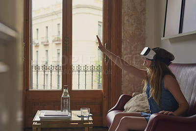 Buy stock photo Woman, touch and vr glasses on home sofa for gaming, virtual reality or futuristic experience. Female person, couch and 3d headset for digital world, technology and interior design app in metaverse