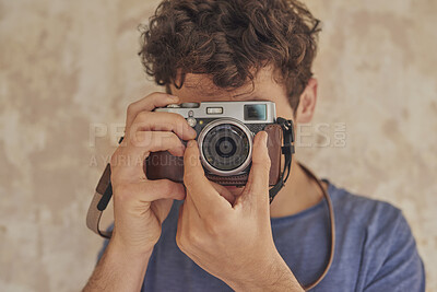 Buy stock photo Man, photographer and camera for photoshoot, production hobby and capture picture in home. Tech, male person and focus with vintage equipment for photography, memory or content creation project