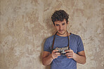 Portrait of cute sexy photographer happy man with vintage camera