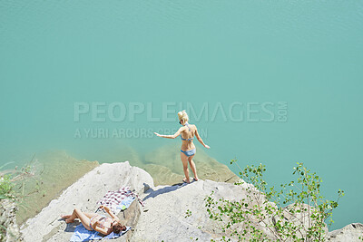 Buy stock photo Travel, swim and friends at lake with fun, good time and bonding together on summer break. Sunshine, above or women at river with space, hangout activity or vacation connection in outdoor getaway.
