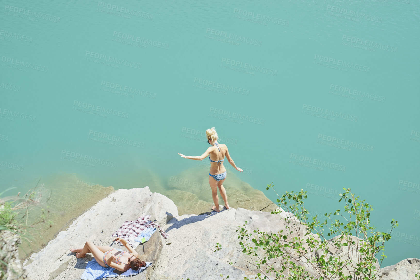 Buy stock photo Travel, swim and friends at lake with fun, good time and bonding together on summer break. Sunshine, above or women at river with space, hangout activity or vacation connection in outdoor getaway.
