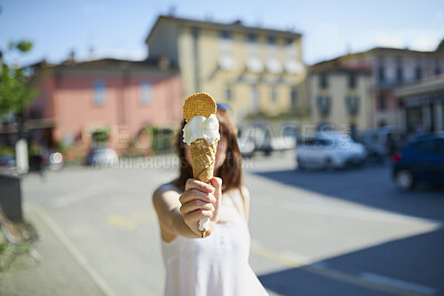 Buy stock photo Woman, hand and ice cream in city with summer holiday, tourist trip and cool snack for hot weather. Person, travel outdoor and gelato dessert cone in town with sweet treat, wafer or vacation in Italy