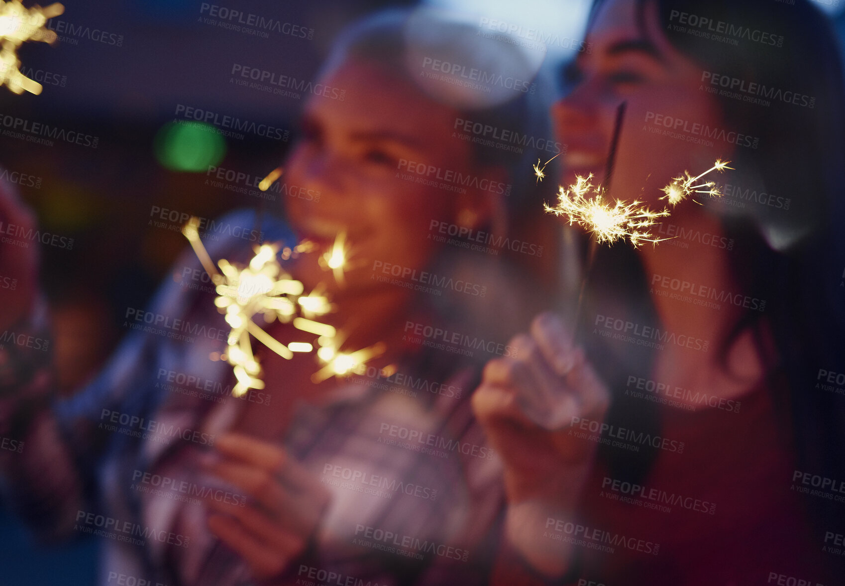 Buy stock photo Night, sparklers or happy women with celebration for new year festivity, birthday party or holiday. Excited, female people or fireworks with smile in late evening for fun event, festival or memory