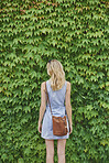 Portrait Beautiful travel woman from behind concept green ivy plants