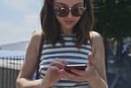 Beautiful Tourist girl happy using smart phone to connect on adventure travel lifestyle
