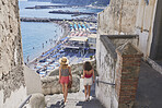 Girl friends travelling in beautiful Italy relaxing summer sea beach vacation exploring to discover carefree lifestyle 