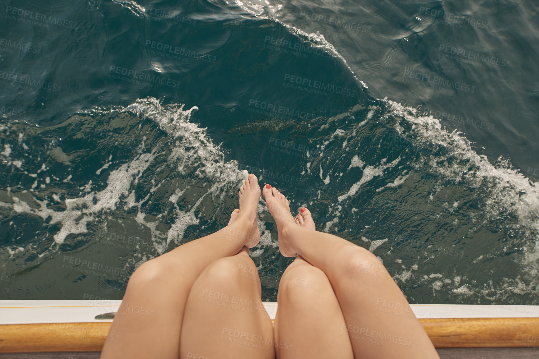 Buy stock photo Travel, legs and ocean with friends on yacht for summer vacation, seaside getaway and peace. Holiday cruise, bonding and sailing with women on boat for tropical journey, tourism and relax together