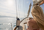 Beautiful woman on sailboat in bikini in ocean on luxury summer lifestyle happy adventure travel vacation