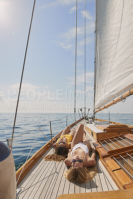 Buy stock photo Travel, peace and ocean with friends on yacht for summer vacation, sea getaway and sun tan. Holiday cruise, bonding and sailing with women on boat for tropical journey, tourism and relax together