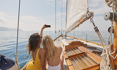 Buy stock photo Travel, selfie and friends on yacht with trip, getaway picture and post update for social media. Back, tourist and women at ocean with connection, digital memory and boating holiday in Australia.