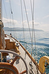 Wooden luxury sailboat sailing over ocean in beautiful blue mediterranean sea 