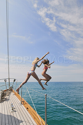 Buy stock photo Jump, travel and freedom with friends on yacht for summer vacation, diving and seaside adventure. Swimming, sailing and tropical cruise with women on boat for ocean expedition, energy and journey