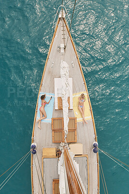 Buy stock photo Friends, phone and travel at sea with boat, summer holiday selfie and relax on deck for luxury getaway. Above, women rest and journey in ocean with yacht, tech and adventure photography for vacation.