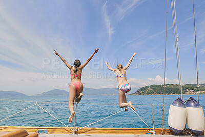 Buy stock photo Travel, jump and ocean with friends on yacht for summer vacation, sea getaway and energy. Holiday cruise, bonding and sailing with back of women on boat for tropical journey, tourism and freedom