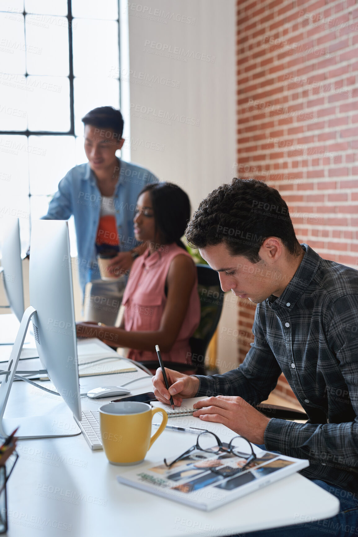 Buy stock photo Graphic design, drawing and man in office with notebook, illustration and sketch for animation. Artist, coworking and writing in workplace with tech, cartoon character and creative art for production