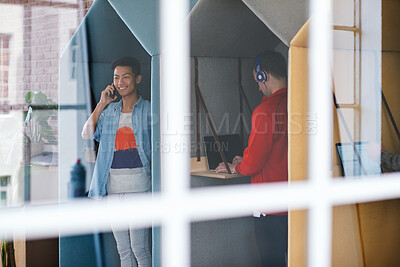 Buy stock photo Phone call, technology and window with designer people in creative workplace for communication. Conversation, laptop and smile of business man in cubicle at coworking office for design feedback