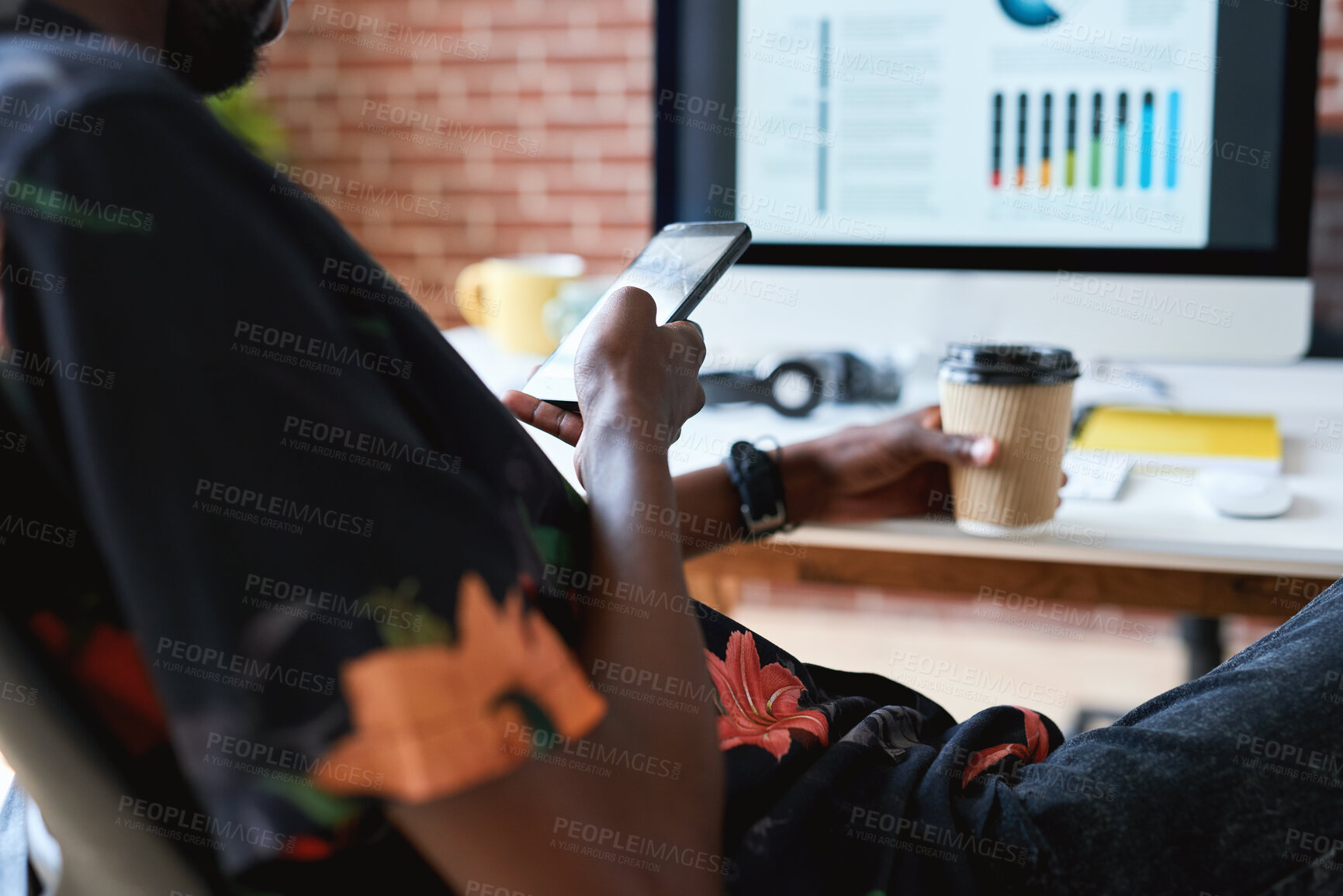 Buy stock photo Coffee, hands and phone with designer at desk in office for communication, report or research. App, takeaway drink and typing with man in design workplace for chatting, feedback or mobile update
