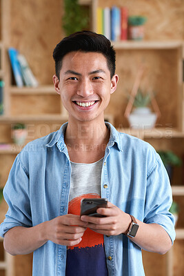 Buy stock photo Happy, phone and portrait of man in office with email for feedback on creative project. Smile, technology and Asian male designer with cellphone for texting on mobile app for review in workplace.