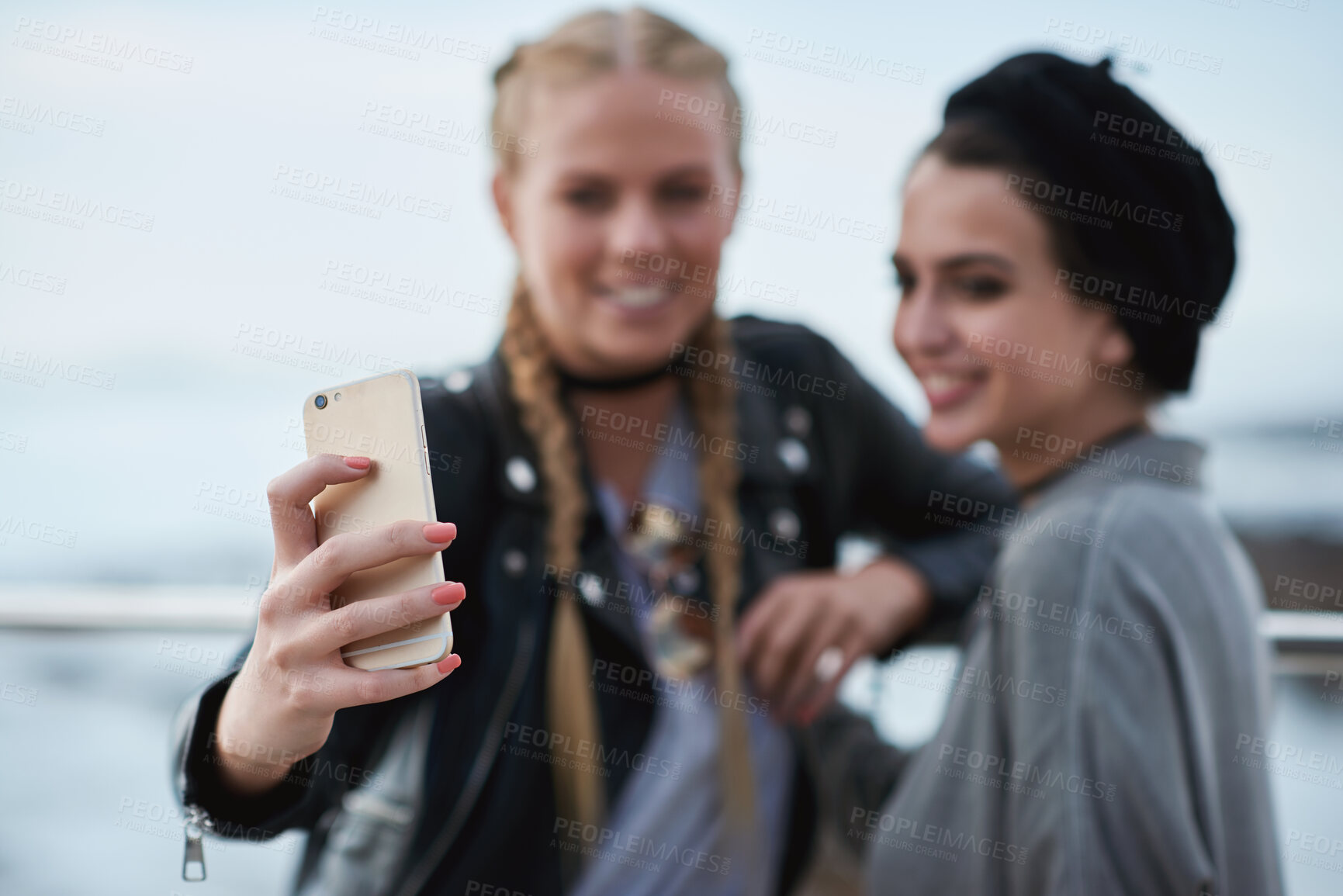 Buy stock photo Friends, fun or hands at beach with selfie, hangout picture or bonding post on weekend break. Smile, space or people at ocean with connection, outdoor trip or memory capture for social media update.