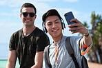 Best friends taking selfie photo on beach using smartphone guys hanging out by seaside sharing fun on social media with mobile phone