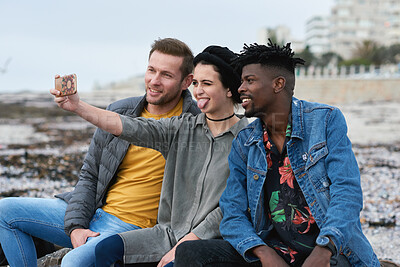 Buy stock photo Selfie, hangout or friends outdoor with tongue out, group picture or bonding post on weekend break. Smile, digital photography or people with fun, trip connection or memory capture for social media.