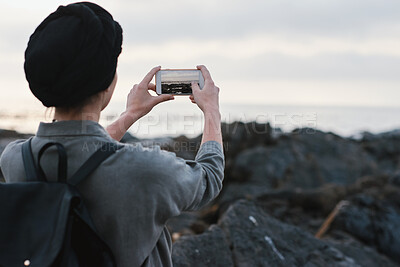 Buy stock photo Outdoor, tourist or person with phone for photography, travel blog or social media post for trip update. Mobile, space or influencer with beach picture for destination vlog, vacation memory or back