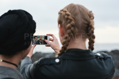 Buy stock photo Beach, friends and women with phone screen, selfie and share memory on social media app and website. Coastline, profile picture and people with mobile for travel vlog, photography and capture image