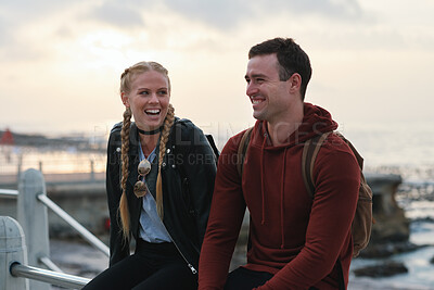 Buy stock photo Outdoor, laughing and couple with sunset for holiday, weekend break and getaway trip for connection. Evening bonding, joke and people with travel for abroad adventure, relax or vacation for happiness