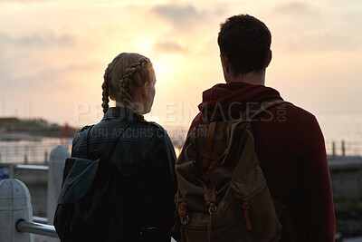 Buy stock photo Outdoor, back and couple with sunset for travel, weekend adventure and holiday trip for connection. Evening bonding, view and people with vacation for abroad tourism, love and sightseeing together