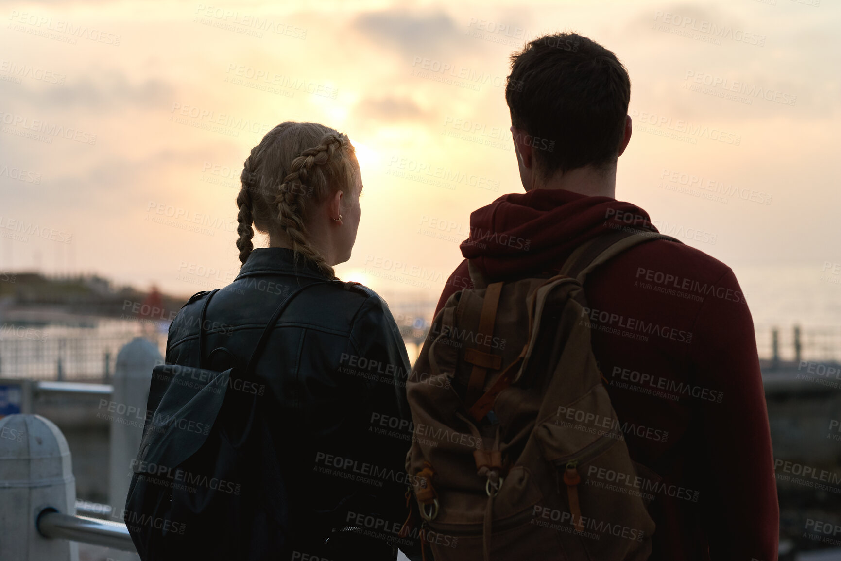 Buy stock photo Outdoor, back and couple with sunset for travel, weekend adventure and holiday trip for connection. Evening bonding, view and people with vacation for abroad tourism, love and sightseeing together