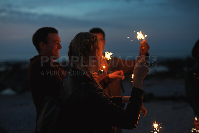 Buy stock photo Party, night and people with sparkler outdoor for celebration, social gathering and bonding together. Friends, fireworks and hang out in nature for new year, festive season and happiness at event