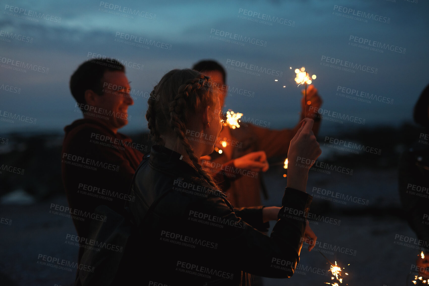 Buy stock photo Party, night and people with sparkler outdoor for celebration, social gathering and bonding together. Friends, fireworks and hang out in nature for new year, festive season and happiness at event