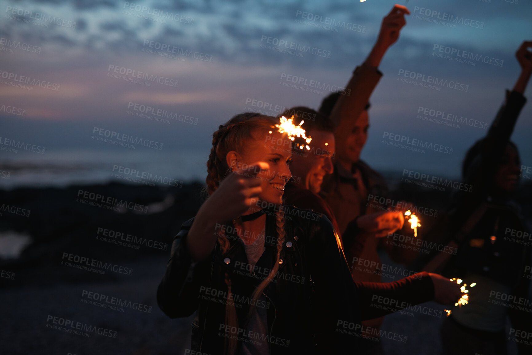 Buy stock photo Party, dance and people with sparkler outdoor for celebration, social gathering and bonding together. Friends, fireworks and moving to music in nature for new year, festive season or excited at night