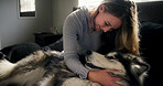Cuddle, dog and love with woman in home living room for affection, bonding or security. Animal care, hugging and smile of happy husky owner on sofa in apartment for companionship, loyalty or trust